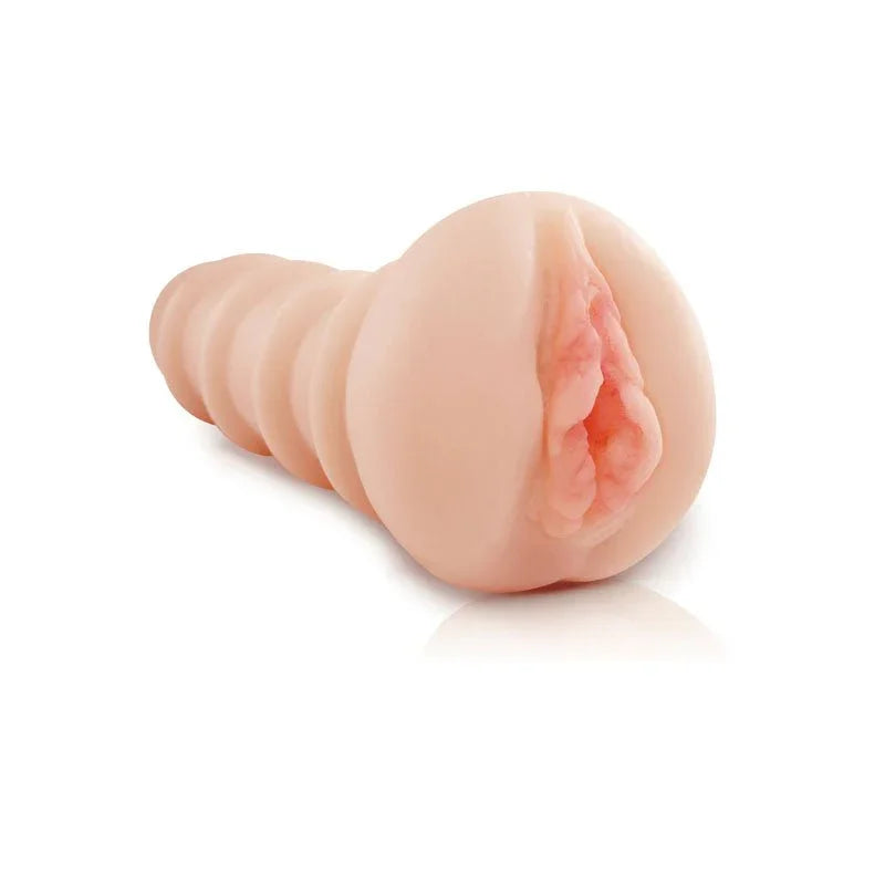Fill Her Up! stroker lying at an angle, ribbed flesh sleeve with a moulded vulva
