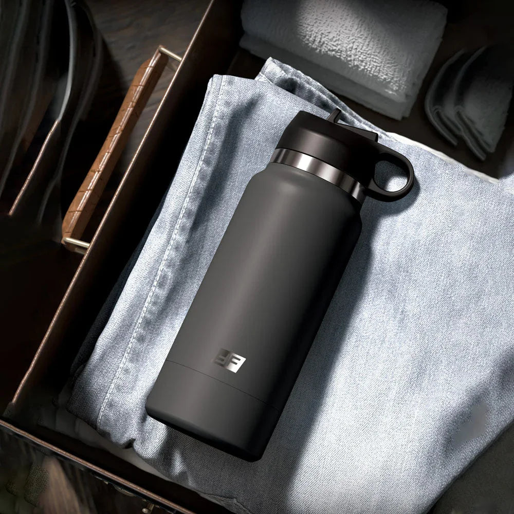 Fuck Flask closed and lying in an open drawer beside folded jeans, disguised as a bottle