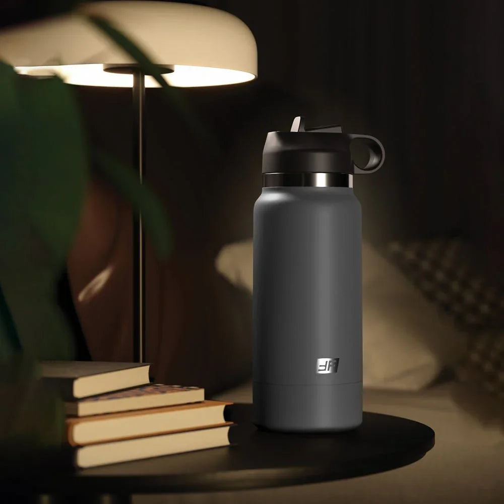 Fuck Flask standing on a side table by a lamp and books, looking like an ordinary flask