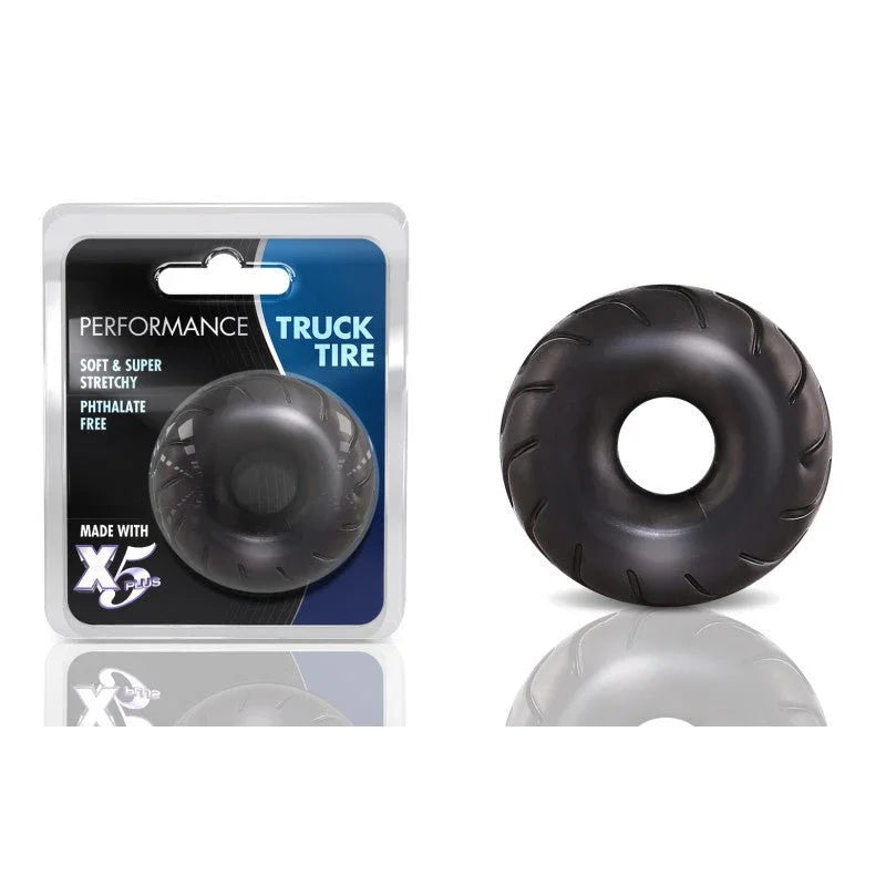 Performance Truck Tire cock ring in black with treaded edge, beside its blister pack