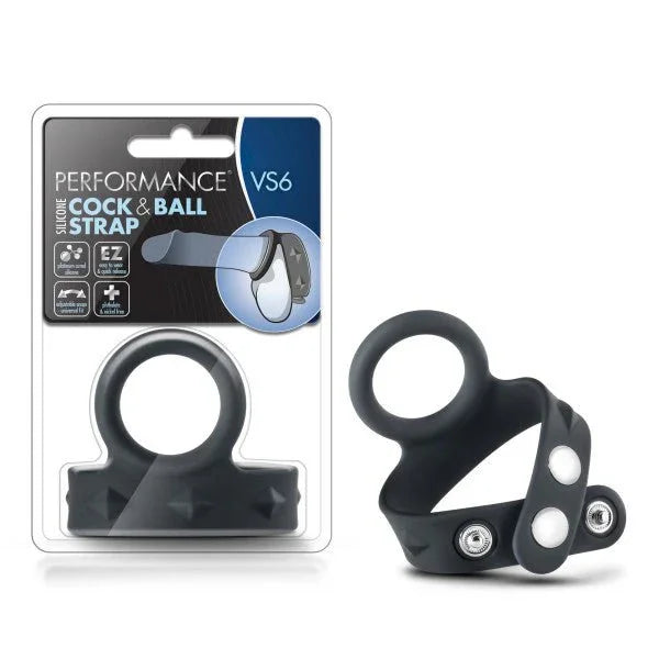 Performance VS6 silicone cock and ball strap in black beside its retail pack