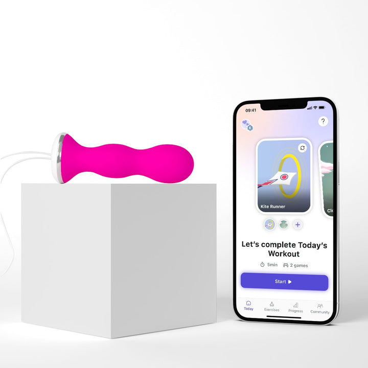 Pink Perifit Care on a white block beside a phone showing the Perifit app workout screen