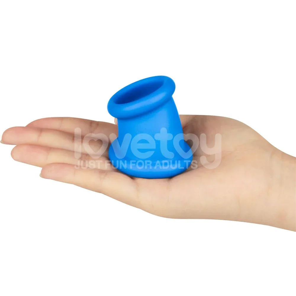 Blue Tapered Squeeze ball stretcher held on a flat palm
