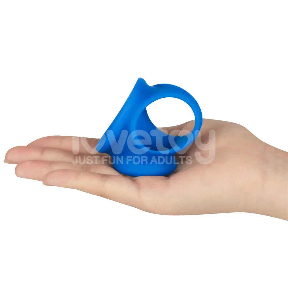 Blue Trio Grip Enhancer held on an open palm, showing the three-lobed silicone sling