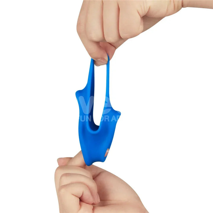 Fingers dangling the blue Trio Grip Enhancer, showing its softness and weight
