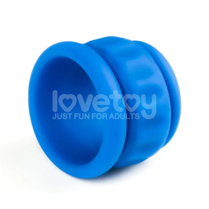 Close-up of the blue Twin Flex ball stretcher, ridged barrel shape on white