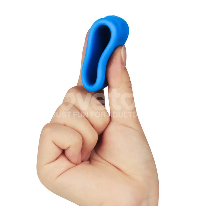 Blue Twin Flex ring stretched over two fingers, showing how far the silicone gives