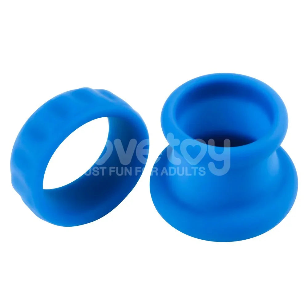 Blue Twin Flex pieces side by side, the flat cock ring next to the taller stretcher