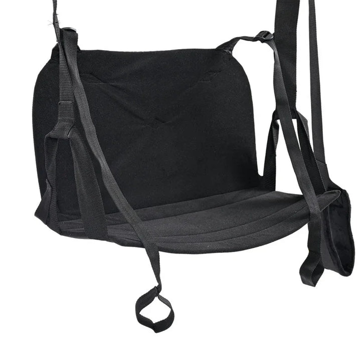 Close view of the sling's padded black seat, leg straps and foot loops