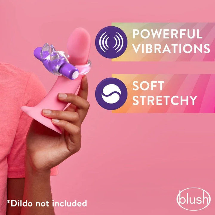 Purple Bull C-ring stretched over a pink dildo in hand, powerful vibrations panel