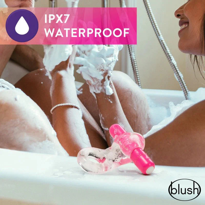 Pink Delight C-ring on a bath edge amid bubbles, IPX7 waterproof panel