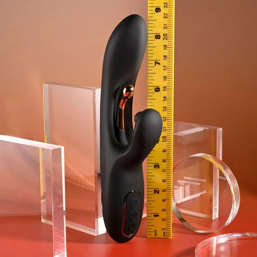Black Aureus rabbit vibrator standing against a ruler at about 9 inches