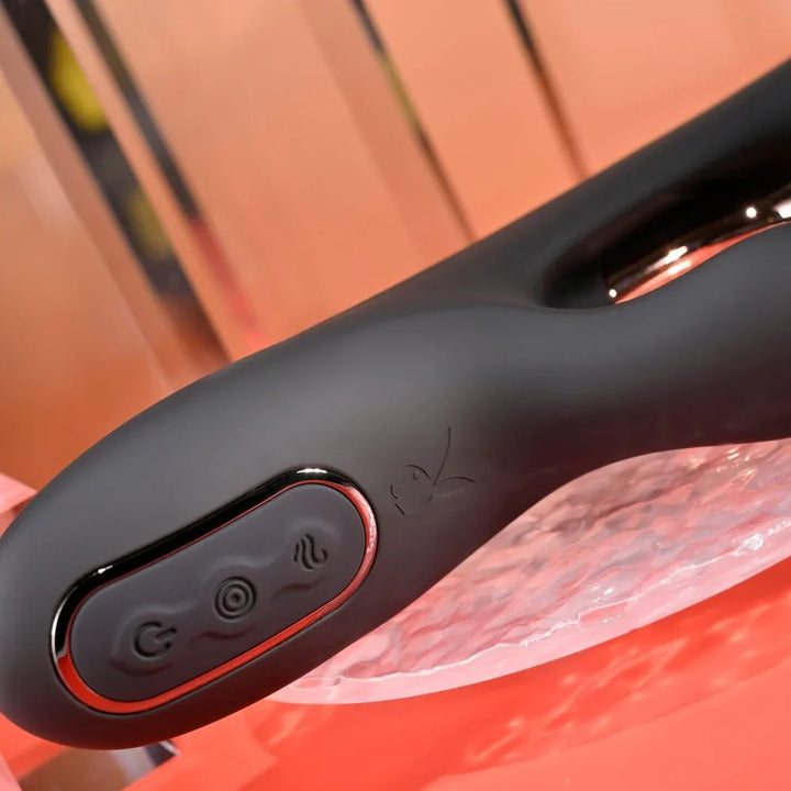 Close-up of the Aureus control panel buttons on the black silicone handle