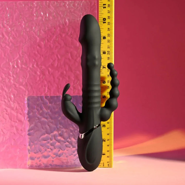 Black Big Bunny Energy standing against a ruler at about 10 inches