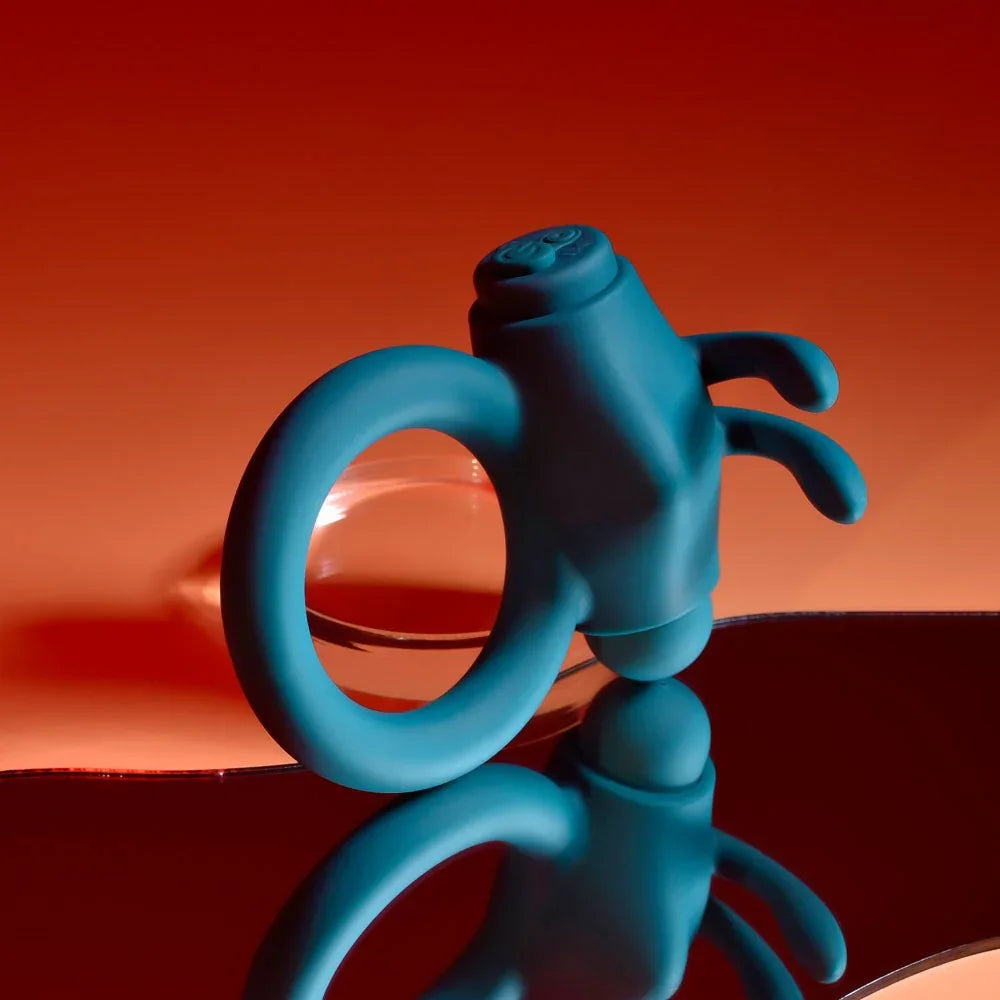 Green Bunny Buzzer cock ring standing upright, showing the stretchy silicone loop