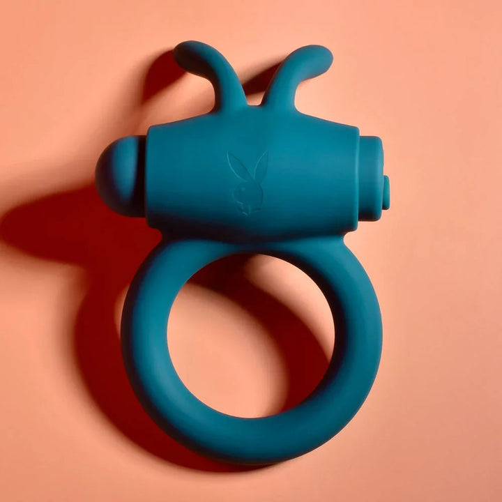 Green Bunny Buzzer cock ring seen from above, bunny ears and bullet motor on top