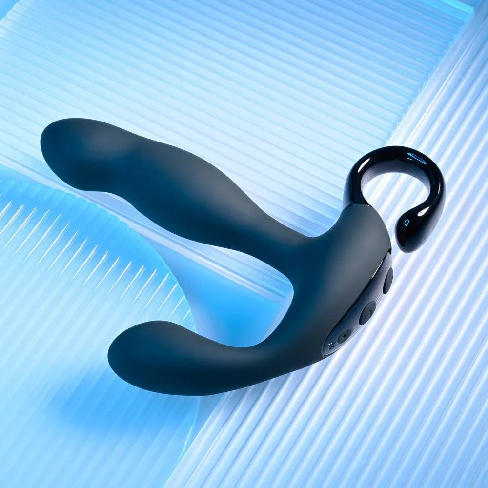 Black Come Hither prostate massager angled across a ribbed blue surface