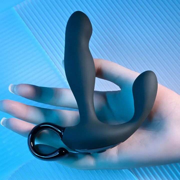 Black Come Hither prostate massager resting on a hand, pull ring hanging down