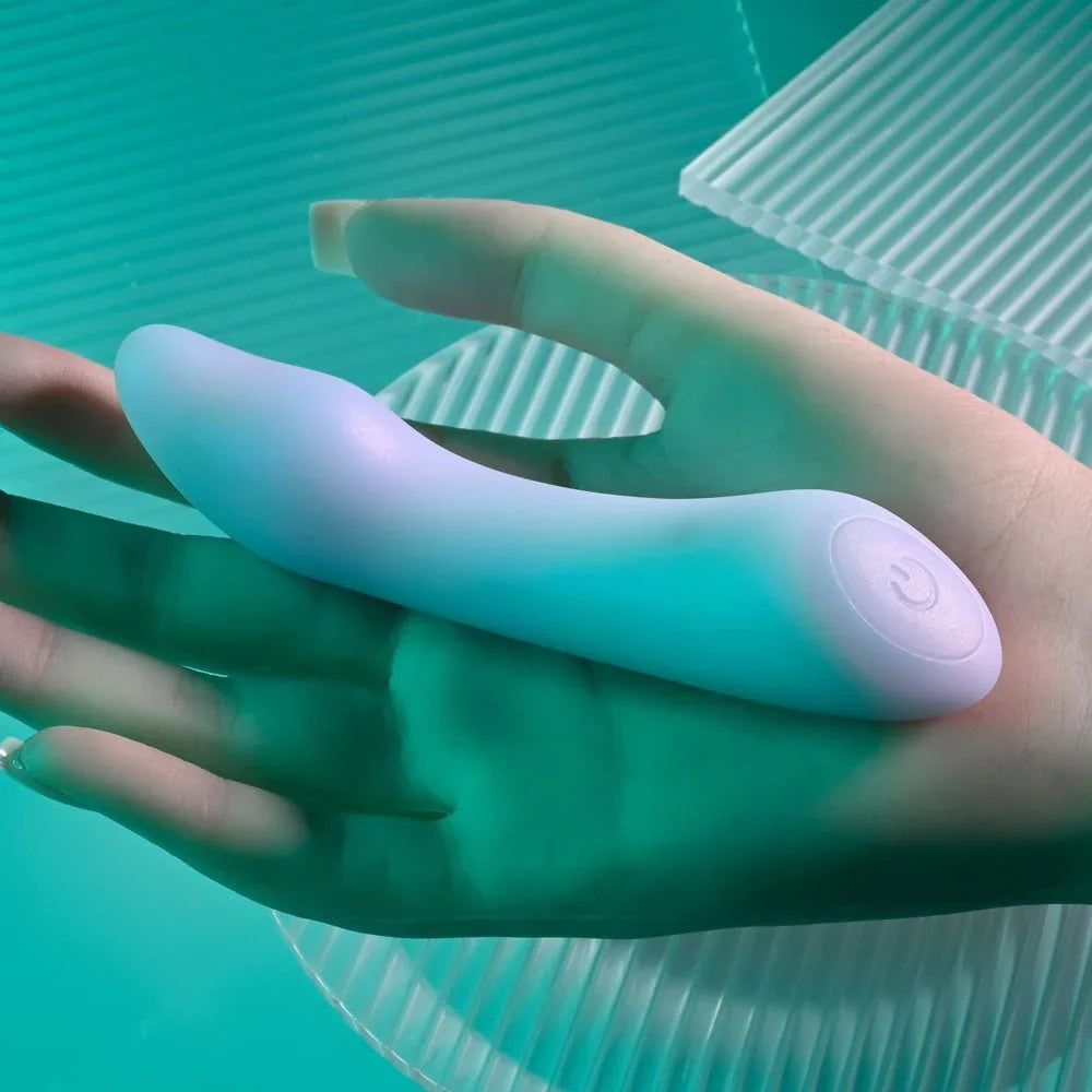Euphoria mini vibrator held across a hand to show its 12 cm size