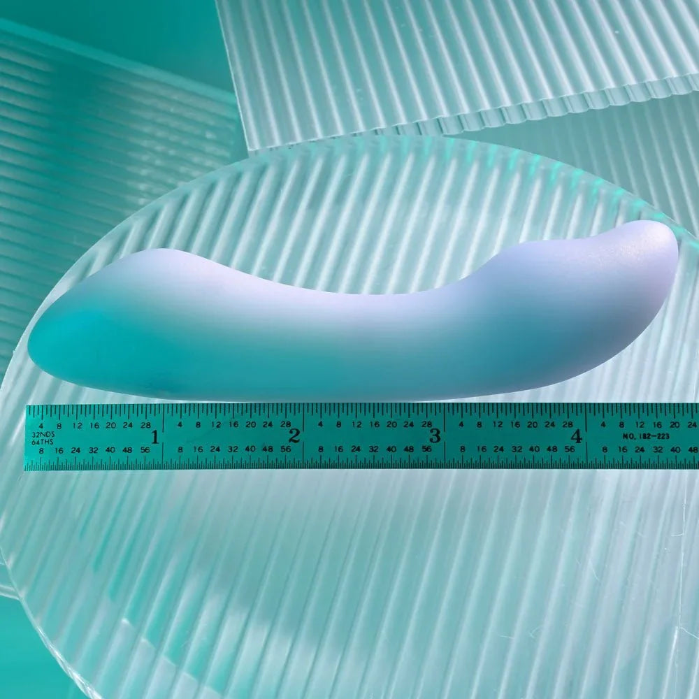 Opal Euphoria mini vibrator laid along a ruler, measuring about 4.5 inches