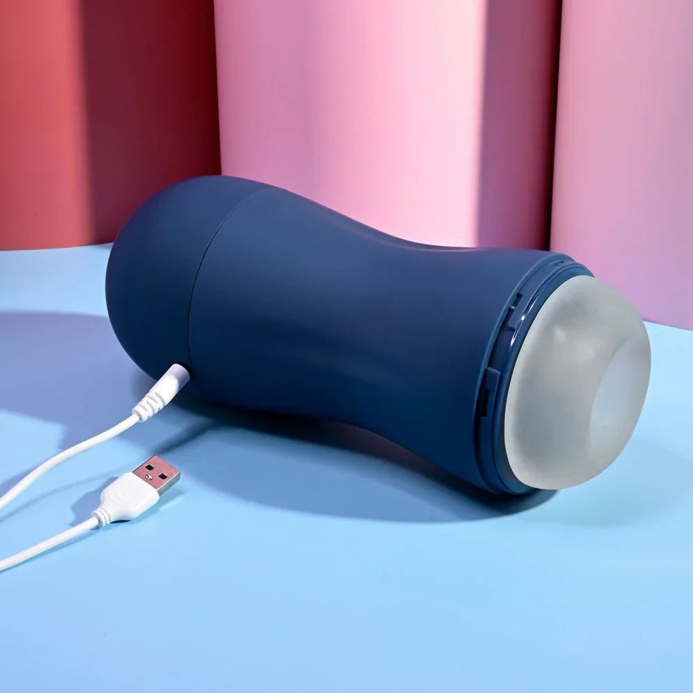 Navy Gusto masturbator lying with its white USB charging cable attached