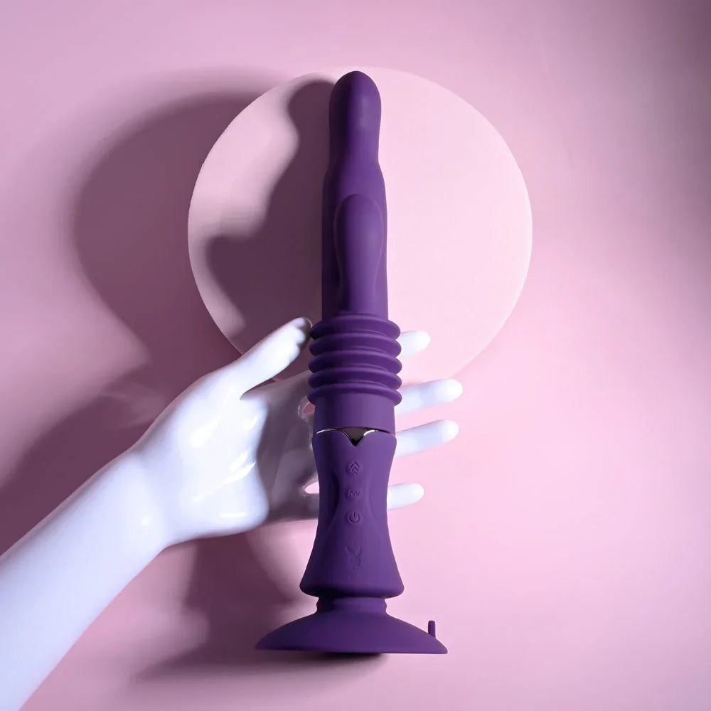 A white display hand resting on the upright purple Hoppy Ending rabbit vibrator