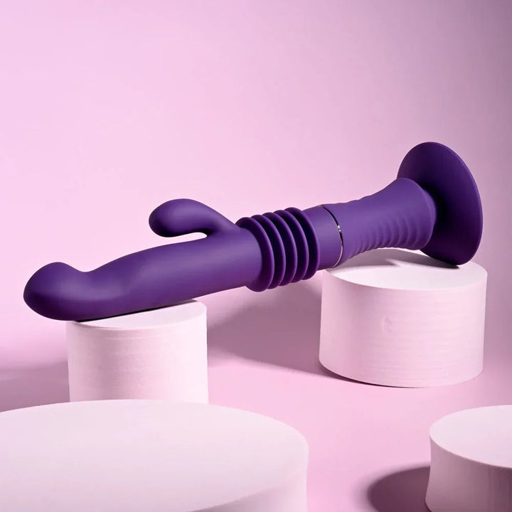 Purple Hoppy Ending lying horizontally across white cylinders, suction base at right
