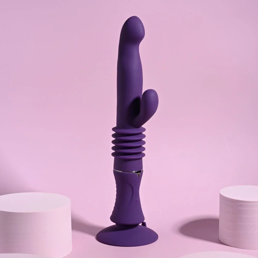 Purple Hoppy Ending rabbit vibrator standing on its suction cup base against pink