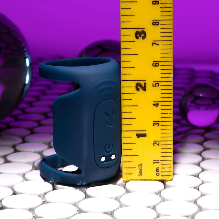 Dark blue Jet Pack harness beside a ruler, about 2.5 inches tall