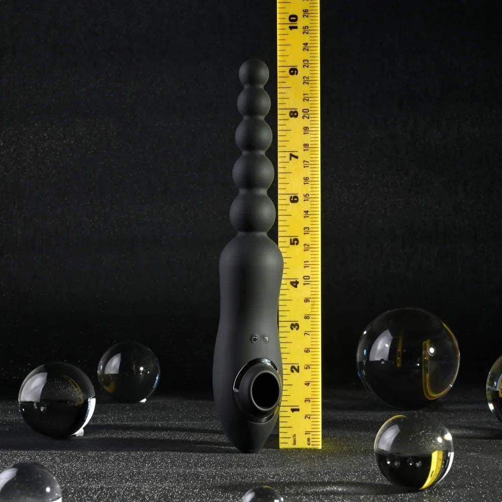 Black Let It Bead standing against a ruler at roughly 9 inches