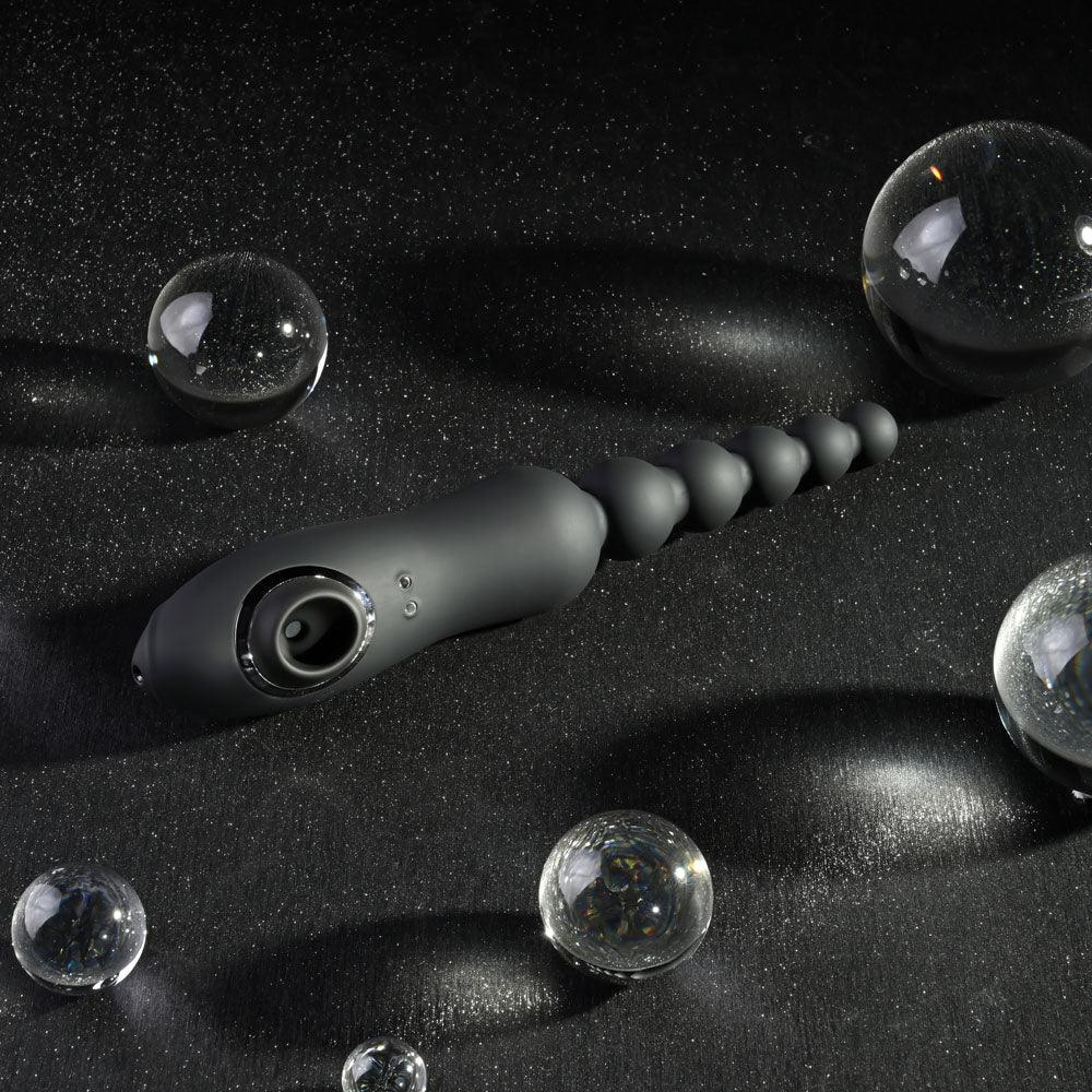 Black Let It Bead with the clitoral suction mouth turned toward the camera