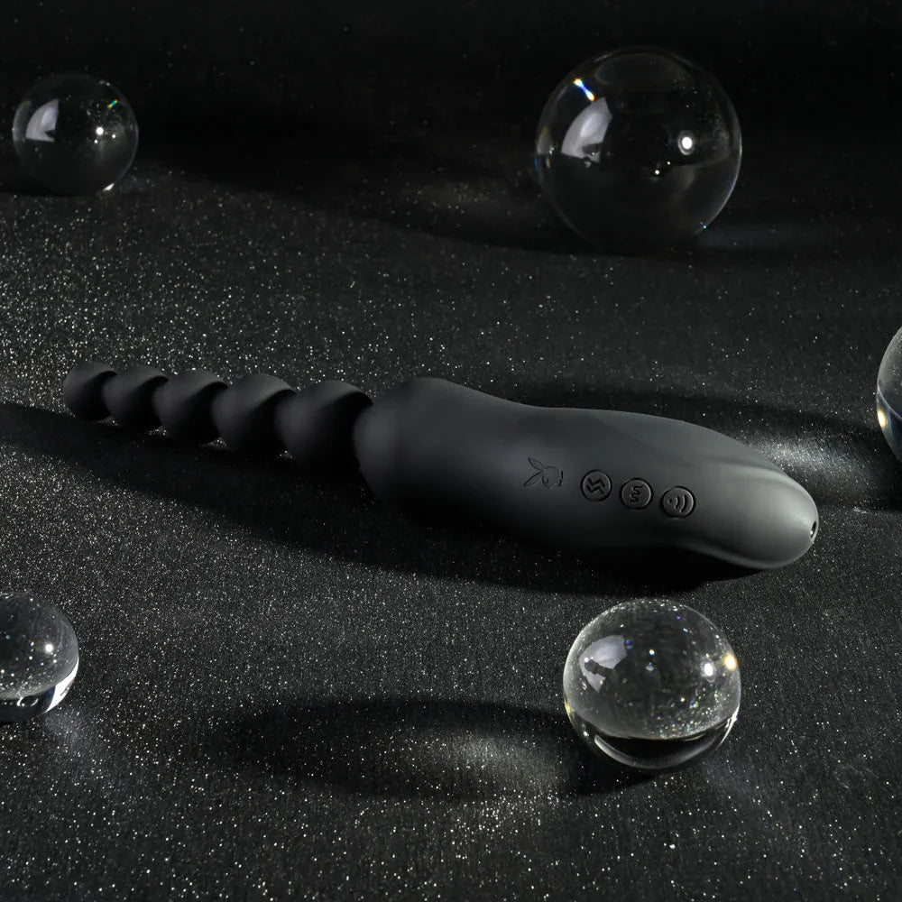 Black Let It Bead laid flat with the bead strand left and suction head right