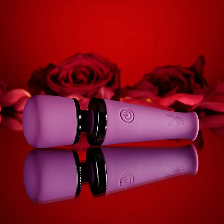 Mic Drop wand lying flat with its soft head to the left, reflected below
