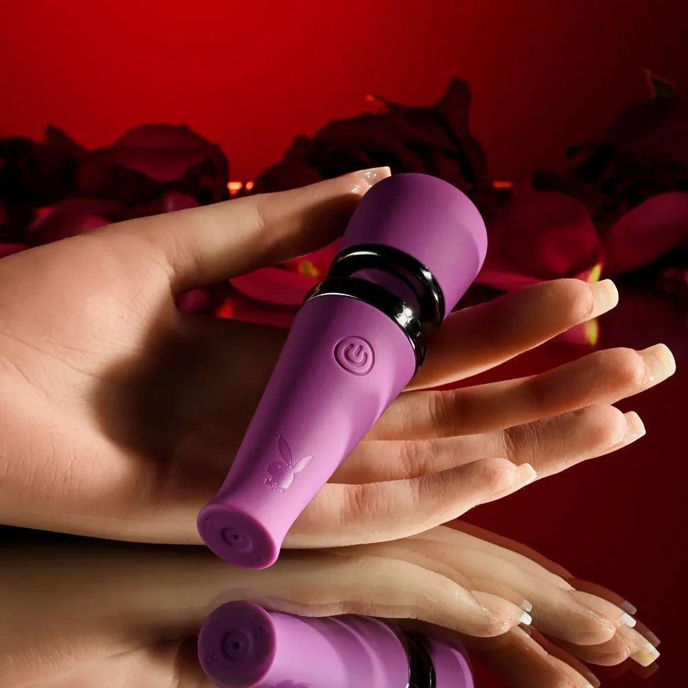 Mic Drop mini wand held in a hand to show how small the 11.4 cm wand is