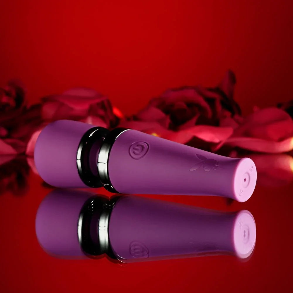 Purple Mic Drop wand at an angle, chrome band and power button in close view