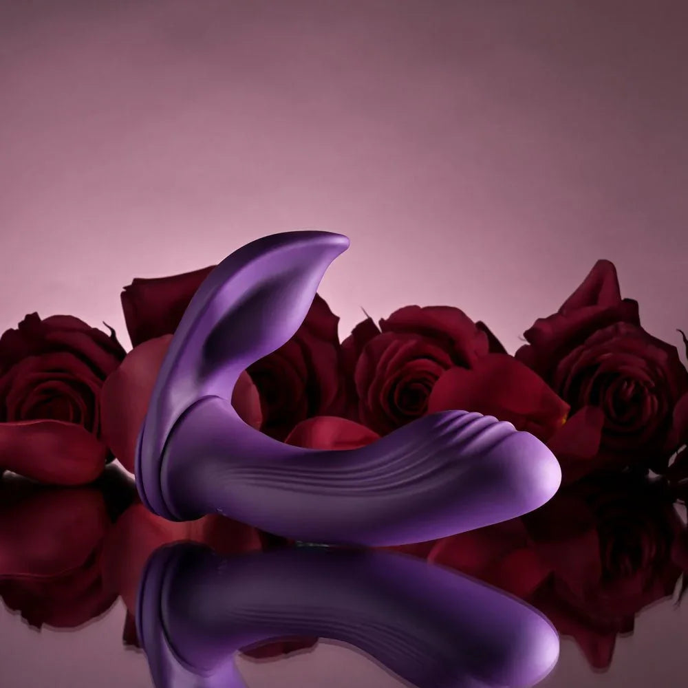 The Mix & Match purple C-ring attachment on its own, resting among rose petals