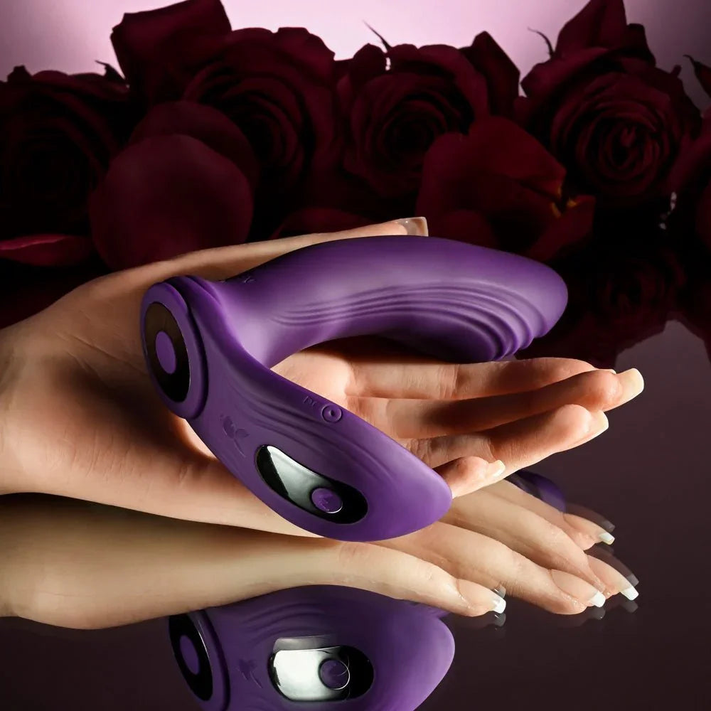Purple Mix & Match vibrator and C-ring attachment cradled in two hands