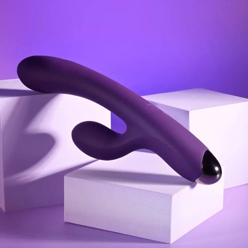 New Crush in purple balanced across a white block with the tip to the right