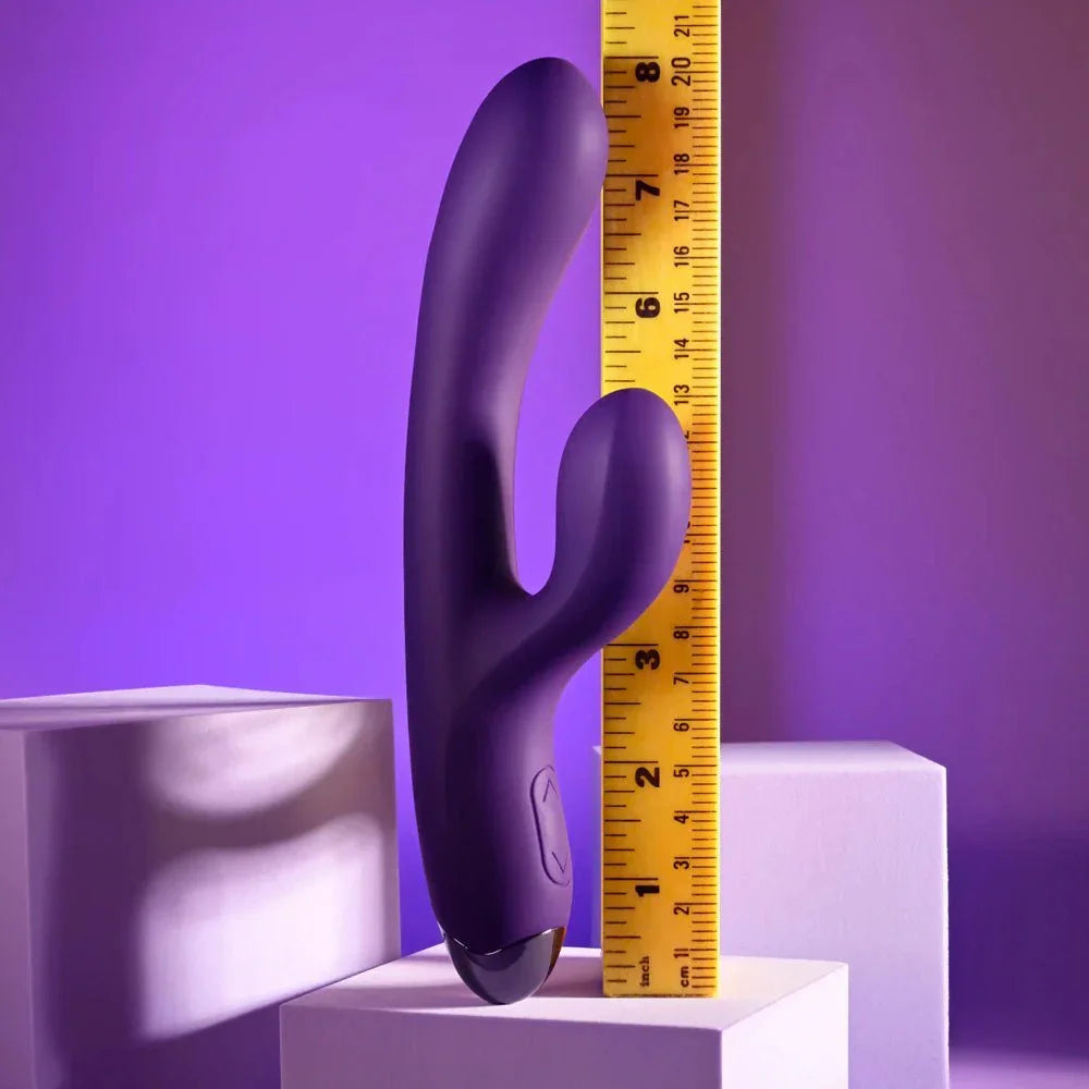 Purple New Crush rabbit vibrator measured against a ruler at about 8 inches