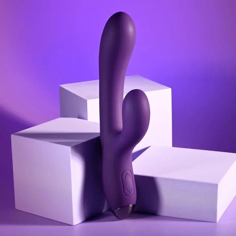 Purple New Crush rabbit vibrator standing upright against white blocks