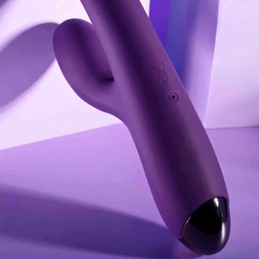 Close-up of the New Crush purple silicone shaft tip and curved clitoral arm