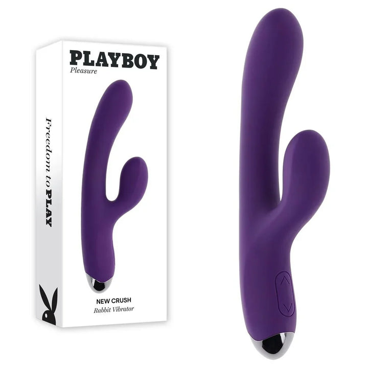 Playboy Pleasure New Crush rabbit vibrator in purple beside its retail box