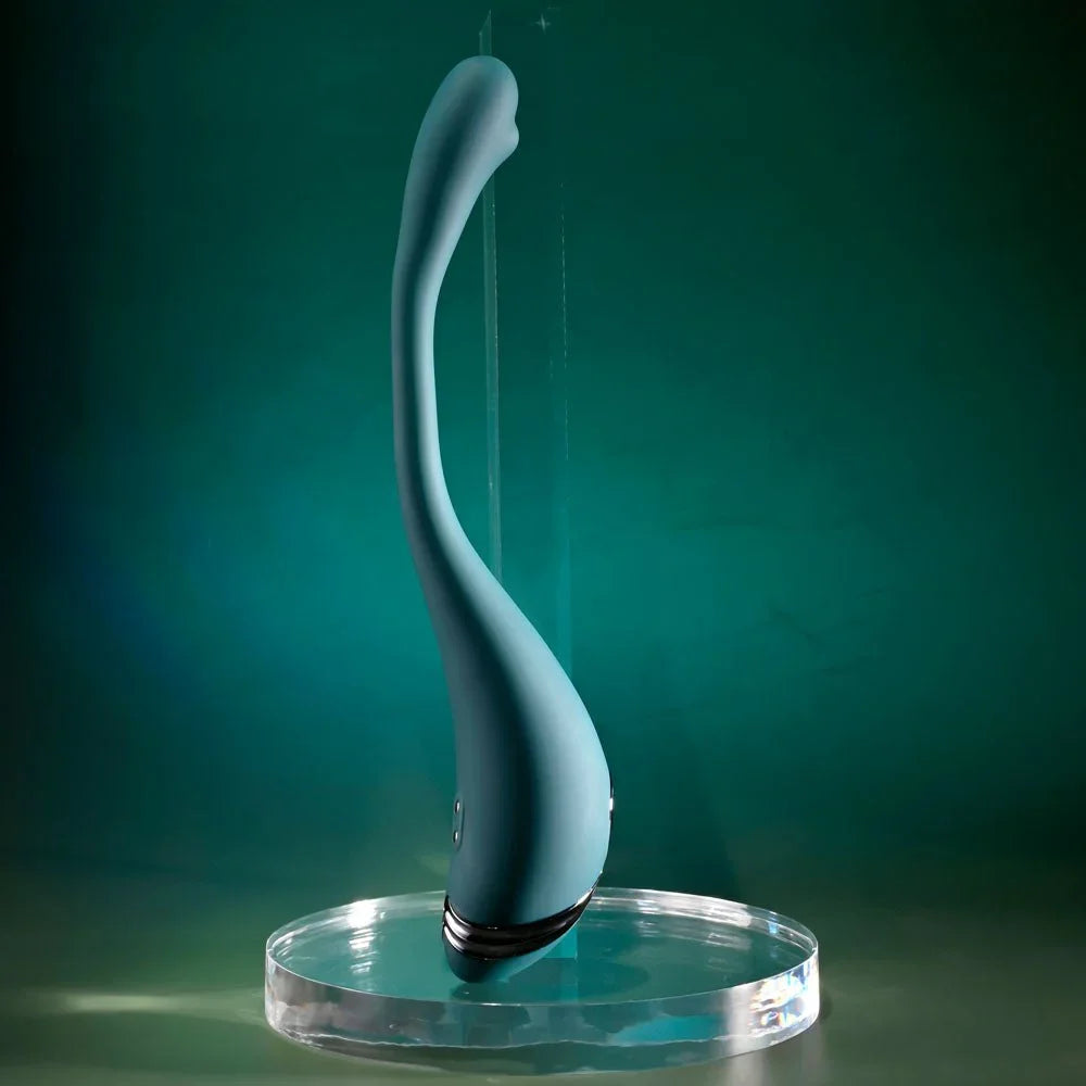 Green Pinpoint Perfection standing upright on a glass disc in a gentle S-curve