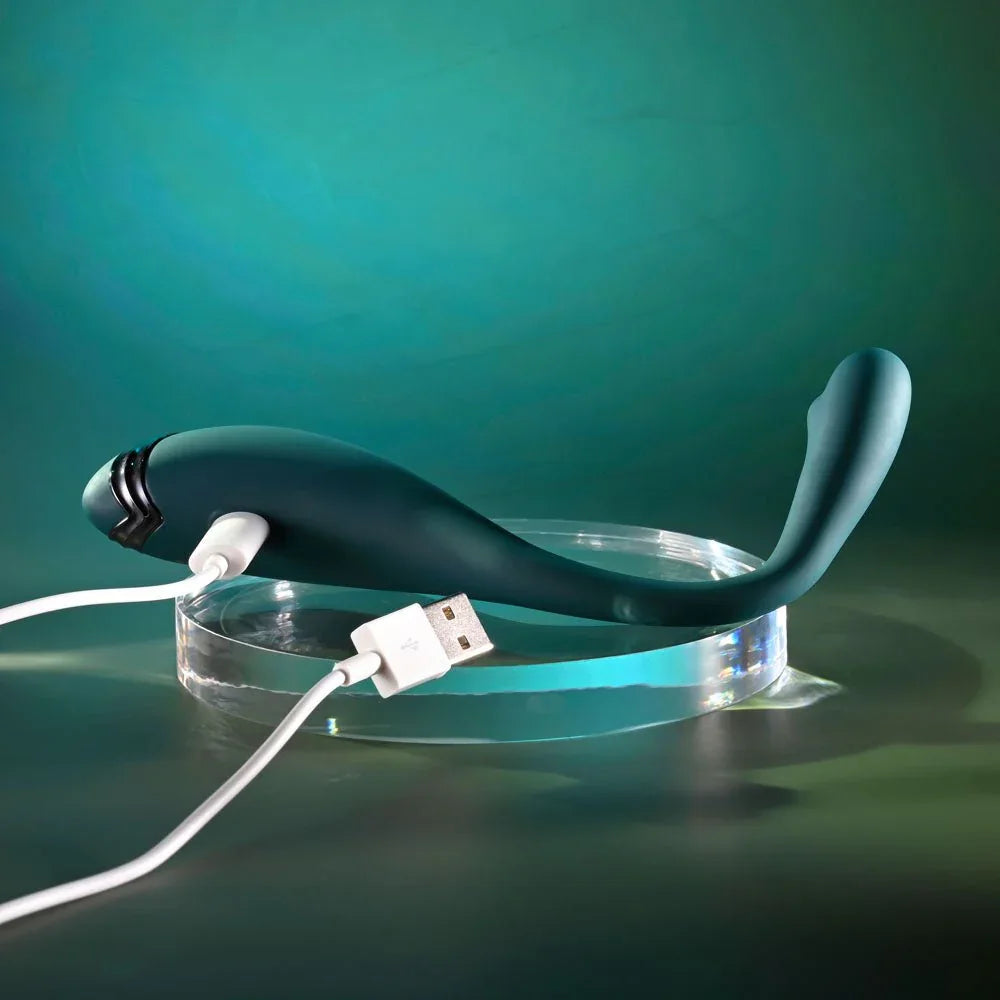 Green Pinpoint Perfection with its white USB charging cable plugged into the base