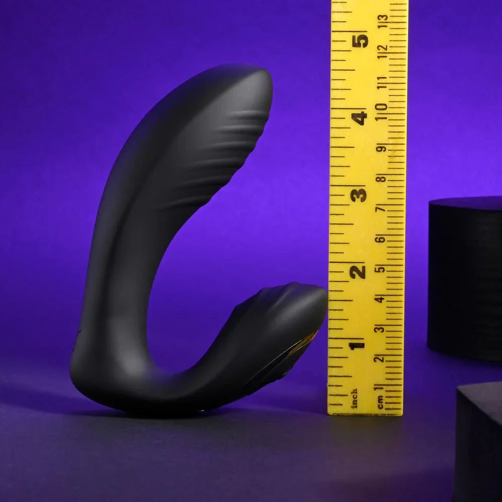 Black Play Time vibrator beside a ruler at about 5 inches