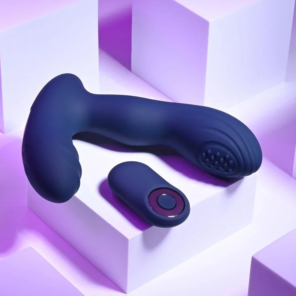 Blue Pleasure Pleaser lying flat, showing the ribbed perineal arm and the remote