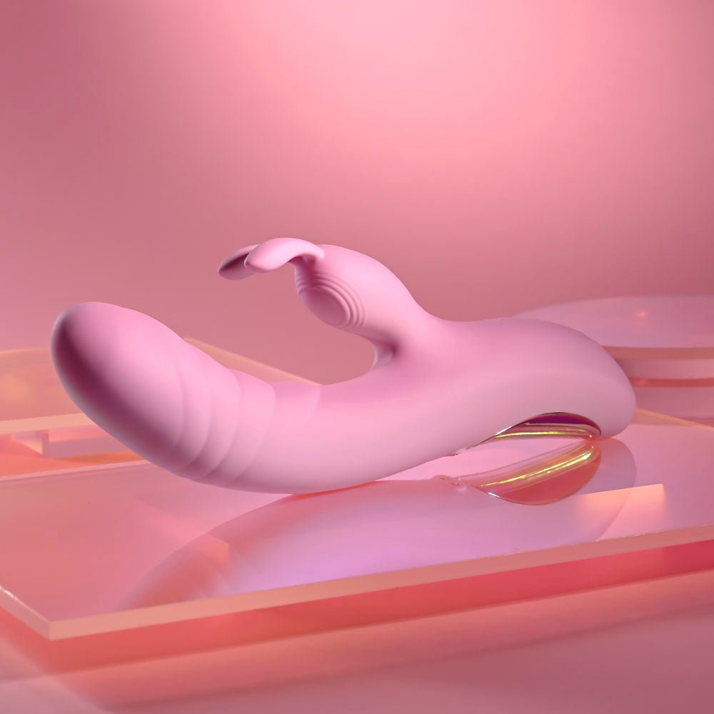 Playboy Pleasure RUB ME RIGHT - Pink 23.2 cm USB Rechargeable Thrusting Rabbit Vibrator – Sex toys NZ by Naughtyhut. Discreet delivery nationwide.