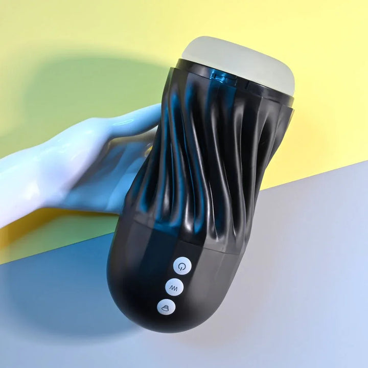 Solo stroker resting on a white display hand, control buttons in view