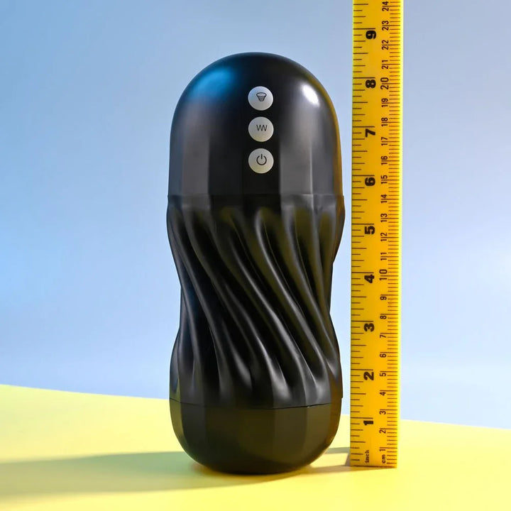 Black Solo stroker standing beside a ruler at about 8 inches