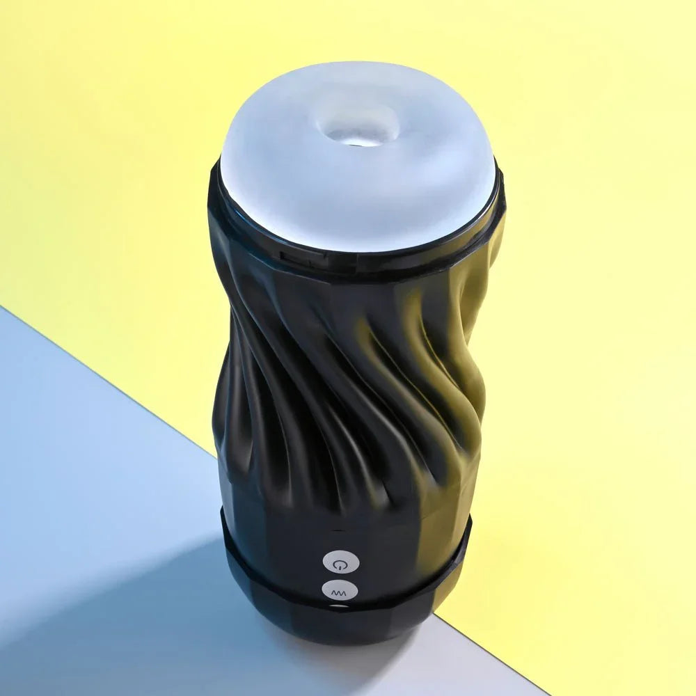 Black Solo stroker standing upright, swirled casing and clear sleeve on top